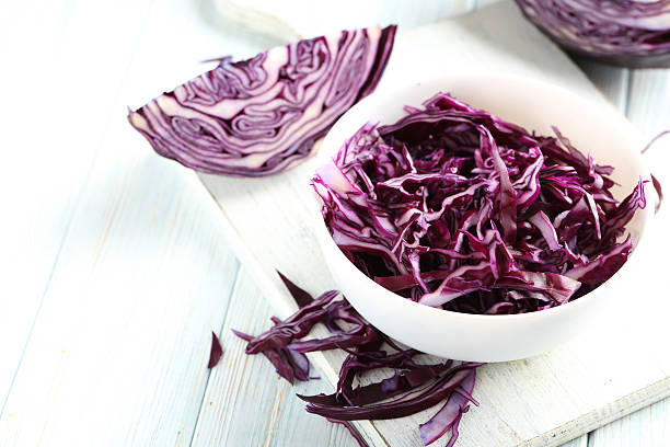 istock Ripe red cabbage on a blue wooden table 524713274