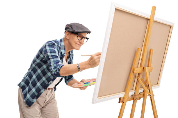 istock Senior painter painting on a canvas 524714642