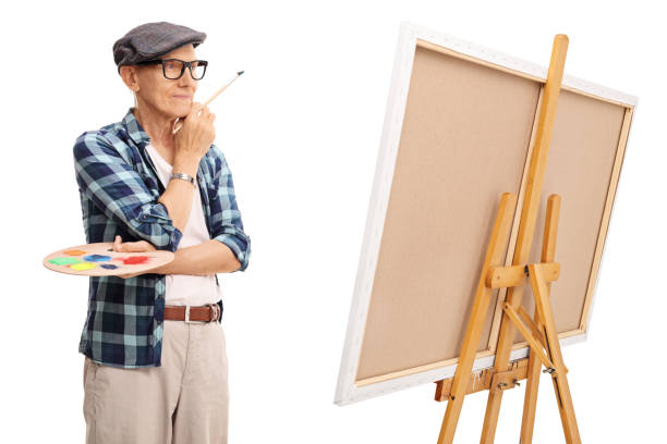 istock Senior painter looking at a painting 524714866