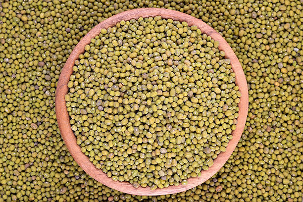 istock Green mung beans in a wooden bowl 524717145