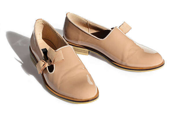 istock beige shoes from a patent leather with a small heel 524717422