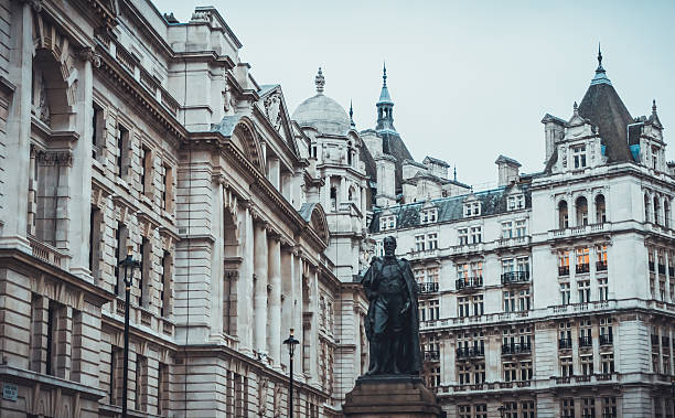 istock Statue of man surrounded by historic buildings 524717696