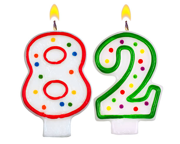 istock Birthday candles number eighty two isolated on white background 524717707