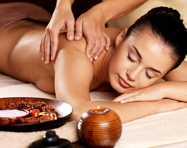 istock Woman having massage in the spa salon 524718372