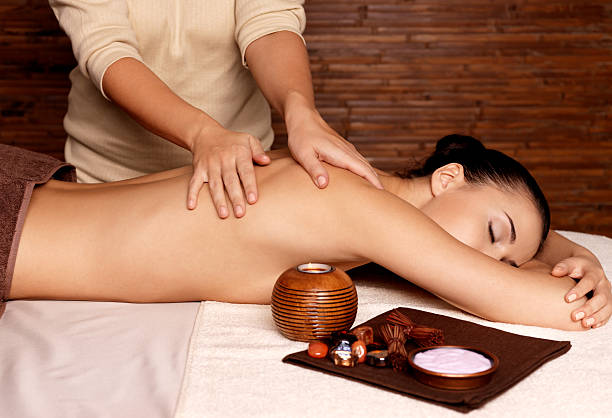istock Woman having massage in the spa salon 524719526