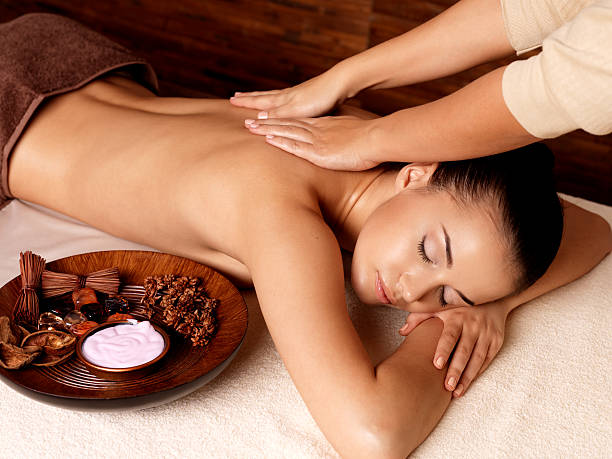 istock Woman having massage in the spa salon 524719818