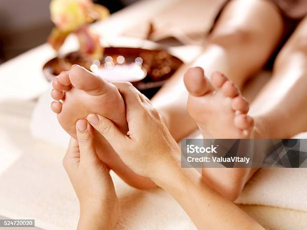 Massage Of Human Foot In Spa Salon Stock Photo - Download Image Now - Massaging, Massage Therapist, Alternative Therapy