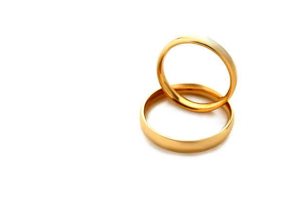 istock Golden wedding rings isolated on a white 524720022