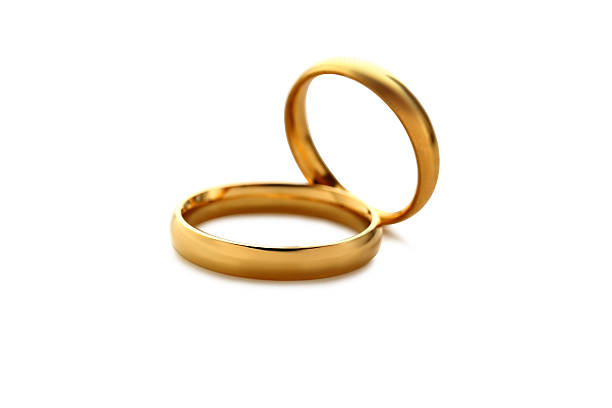 istock Golden wedding rings isolated on a white 524720042