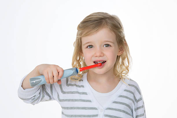 dziewczyna mycia zębów - toothbrush pink turquoise blue zdjęcia i obrazy z banku zdjęć