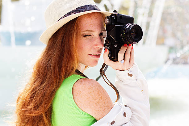 istock Nice girl photographer at work 524720445