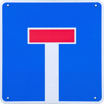 No through road traffic sign. Dead end road sign. Vehicle will not be able to pass through. Information for drivers on blue square plate board. Red and white colors. Nature as background. Close up