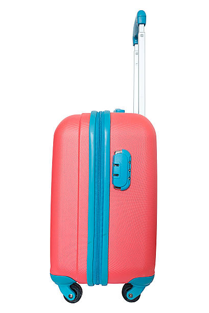 istock Orange travel plastic suitcase with wheels realistic on white background 524721358