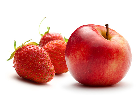 Apple and ripe strawberry on white