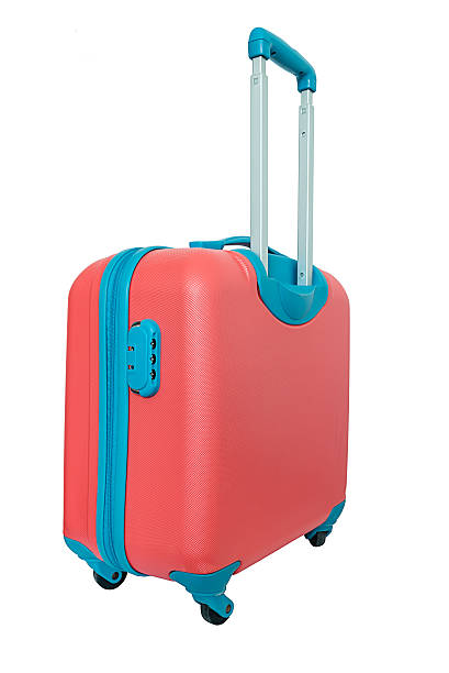 istock Orange travel plastic suitcase with wheels realistic on white background 524721406