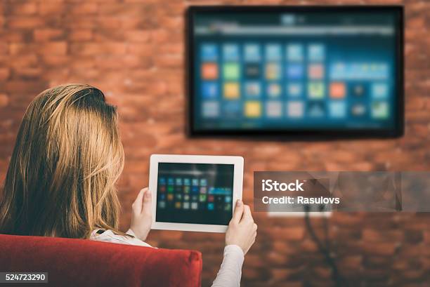 Closeup Of A Tablet Is Connected To A Smart Tv Stock Photo - Download Image Now - Television Set, Digital Tablet, Intelligence