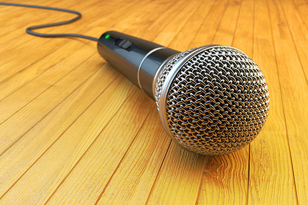 Closeup view of microphone on wooden stage