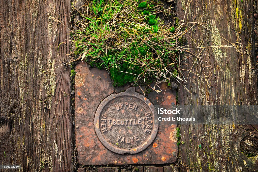 The Derelict Graving Docks at Govan, Glasgow A rusting scuttle valve amongst the overgrowth at the derelict Victorian graving docks - a type of dry dock - in Govan, Glasgow, on the River Clyde. Govan Stock Photo