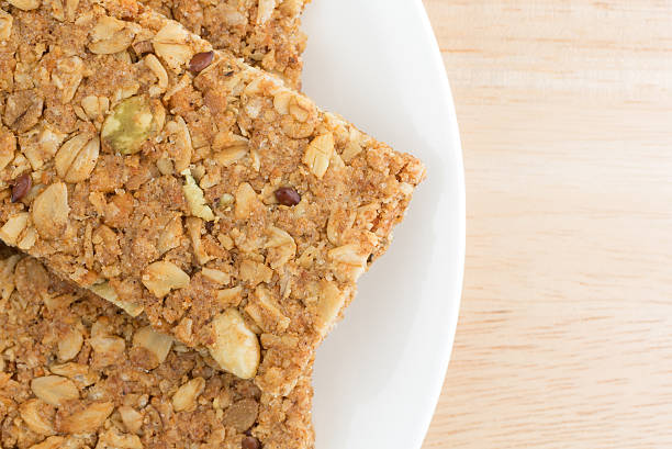 istock Cinnamon sesame and pumpkin seed granola bars on a plate 524723764