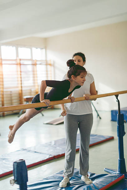 istock Girl Exercise On Gymnastics Bar. 524724572
