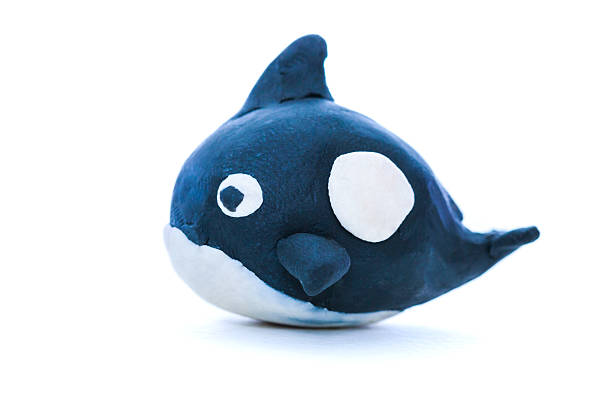 istock Cartoon black whale model from clay. Isolated on white backgroun 524727684
