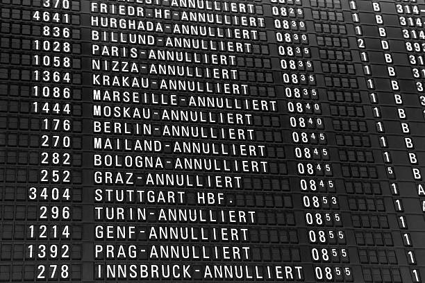Departure Board with Cancelled Flights Departure Board with Cancelled (Annulliert) Flights. cancellation photos stock pictures, royalty-free photos & images