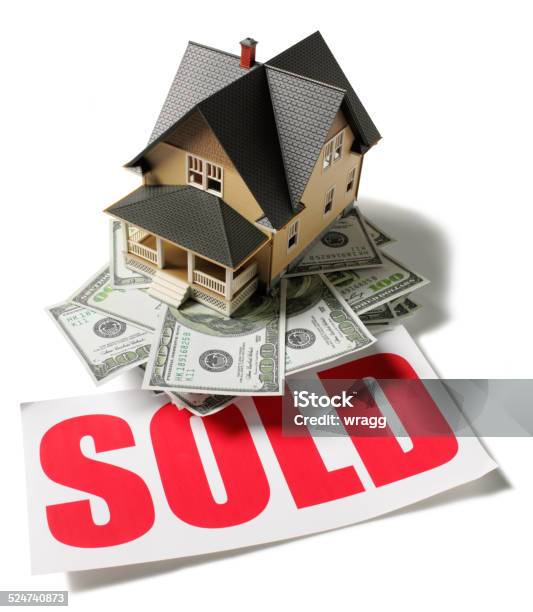 Red Sold Sign With American Dollars And Toy Model House Stock Photo - Download Image Now