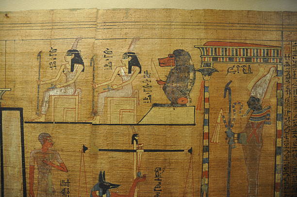 istock Full color Egyptian hieroglyphics on papyrus depicting Thoth and Osiris 524740889