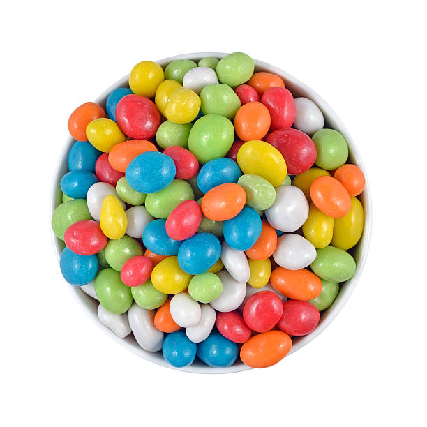 istock Candy sea pebbles in a white bowl on a white 524742523