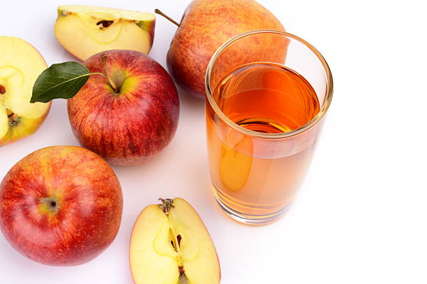 istock Close-up shot sliced red apple with juice view from top 524743117
