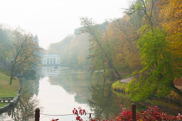 istock Lake scene in autumn park 524746111
