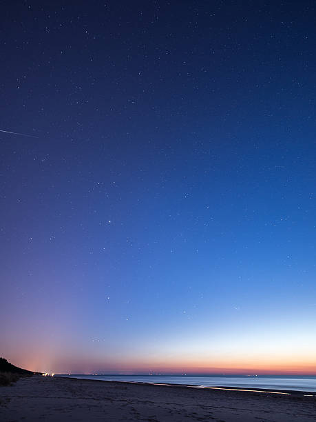 istock night sky with stars on the beach. space view. 524771781