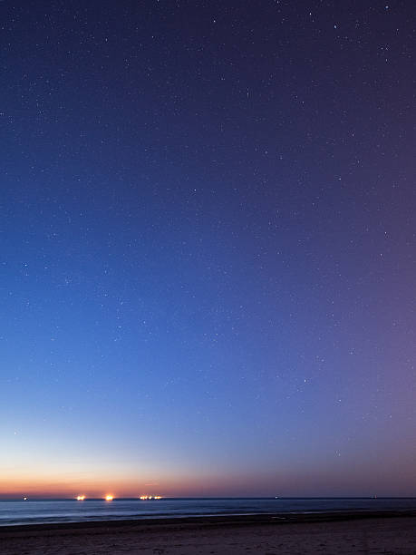 istock night sky with stars on the beach. space view. 524771797