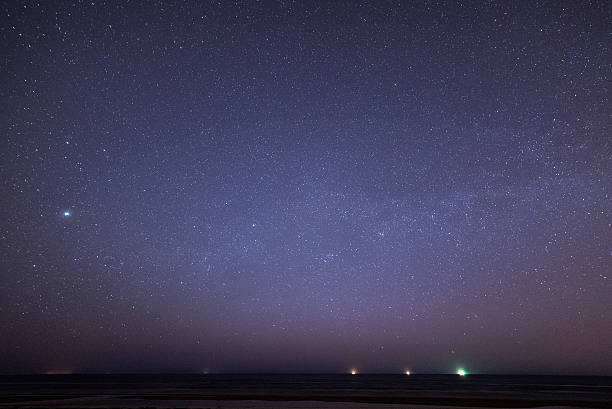 istock night sky with stars on the beach. space view. 524771799