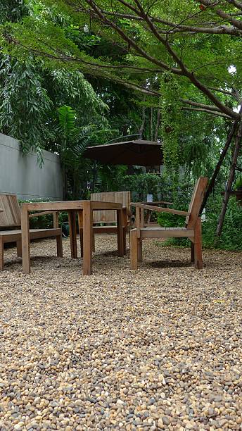 istock Home backyard with wooden benches, tables and brown umbrella. 524773205