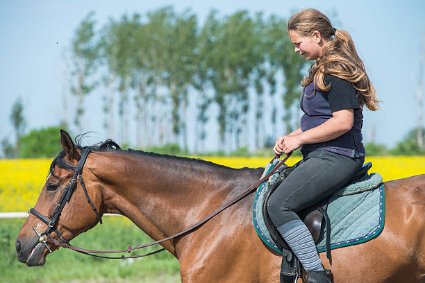 istock girl riding a horse 524774767