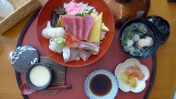 istock sashimi on rice. salmon, egg, shrimp, tuna, squid 524774843