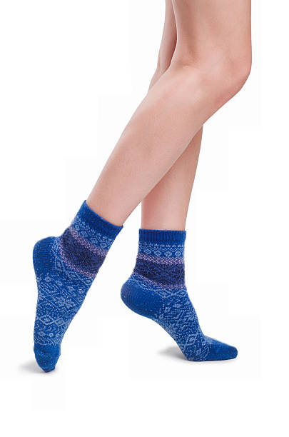 istock Perfect female legs in blue knitted socks 524775103