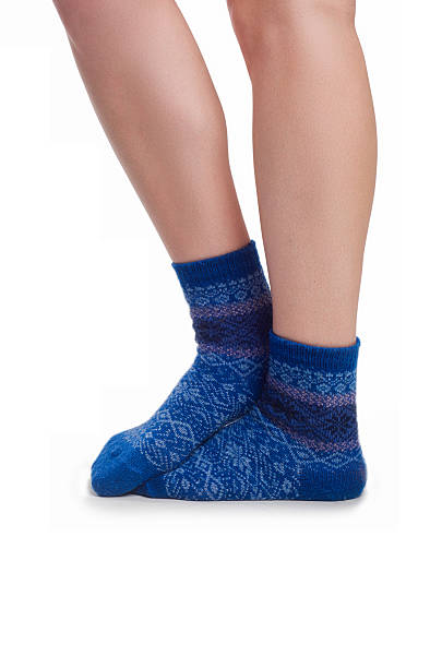 istock Perfect female legs in blue knitted socks 524775115