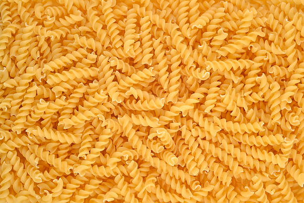 istock Italian pasta fusilli background. 524776865