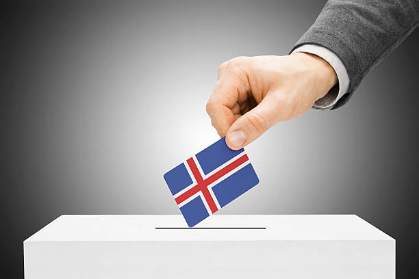 istock Male inserting flag into ballot box - Iceland 524777437