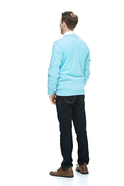 istock Rear view of man standing & looking away 524778403