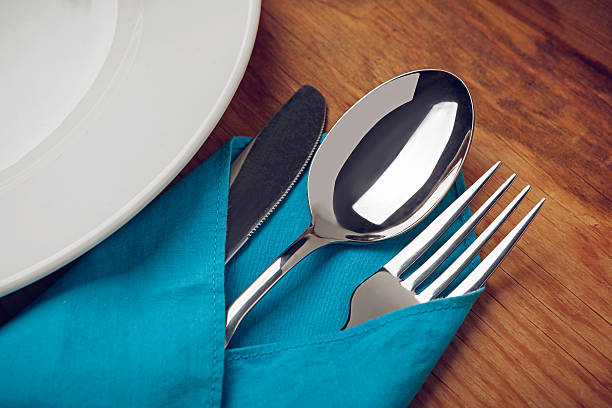 istock Knife, Fork, Spoon and plate on wooden table. 524779005