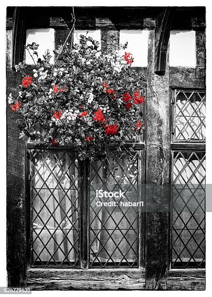Detail Of Window And Flowers From English Tudor Houses Stock Photo - Download Image Now