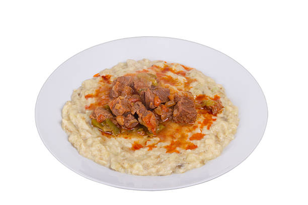 Sultans Delight Sultans Delight (Hünkar Beğendi) from Ottoman Cuisine. Lamb Stew Served on a Bed of Aubergine Purée hunkar begendi stock pictures, royalty-free photos & images