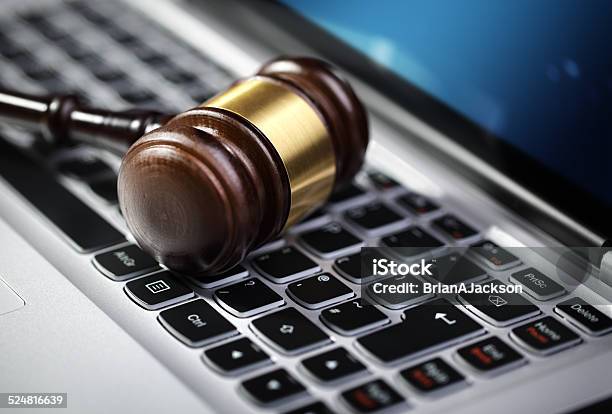 Justice Gavel And Laptop Computer Keyboard Stock Photo - Download Image Now - Remote Location, Legal System, Lawyer