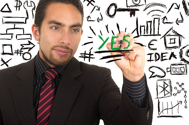 istock young handsome businessman writing on whiteboard with marker 524822875