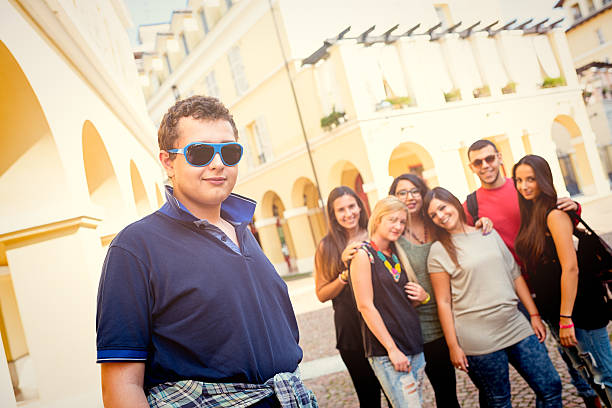 istock Teenage student boy with friends 524823981