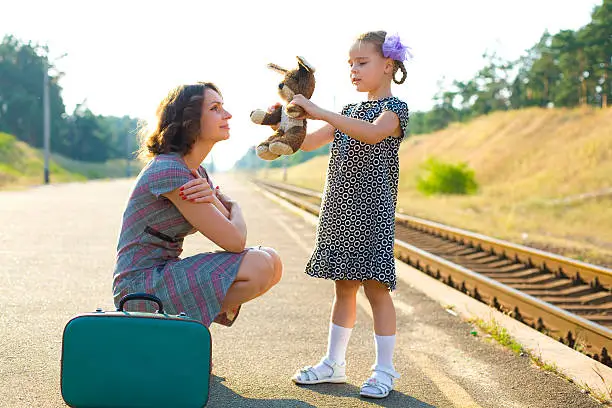 Photo of Mother and daughter on the train platform