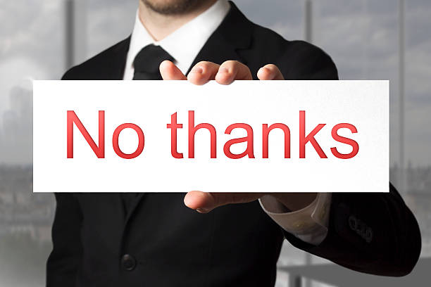 istock businessman holding sign no thanks refusal 524856353